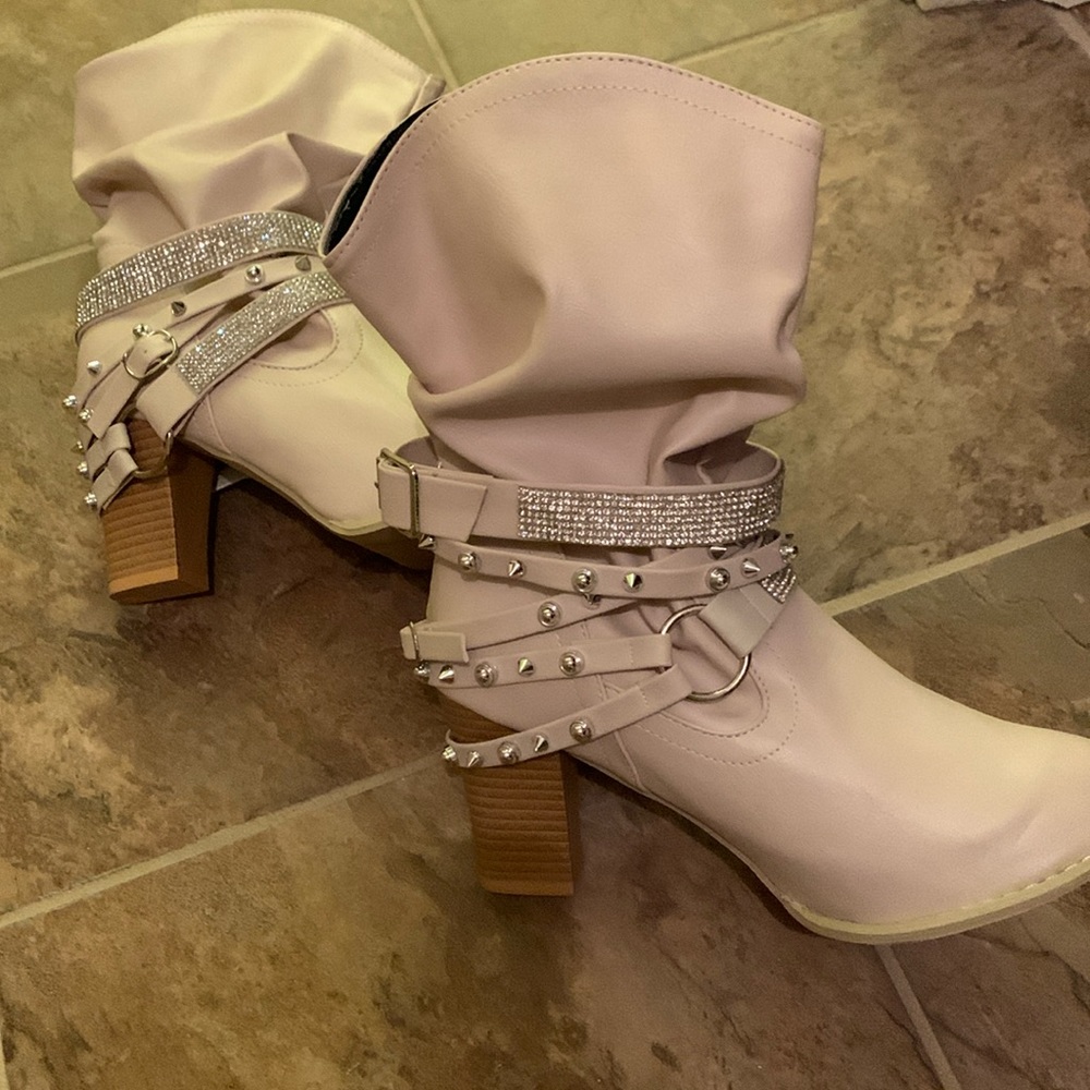 Slouched booties pull on studded  strapping around ankle
